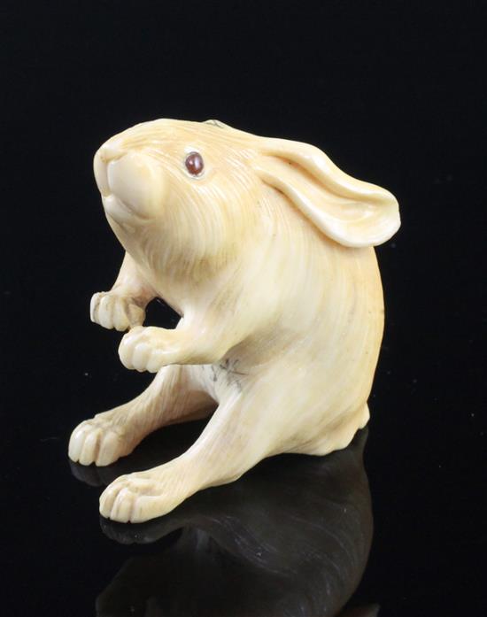 A Japanese ivory okimono of a hare, early 20th century, height 5.4cm, age cracks